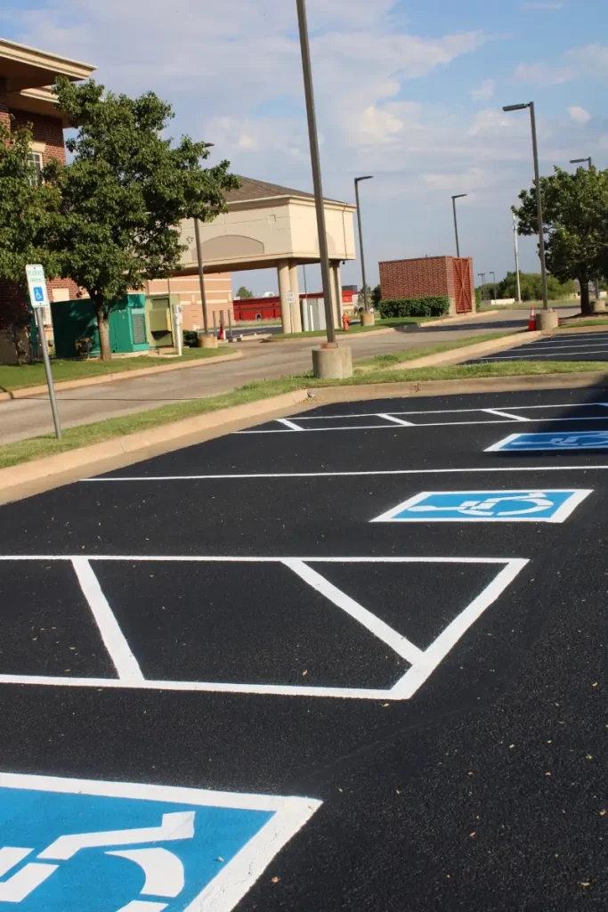 Newly striped ADA parking stalls after commercial sealcoating at Saltgrass Steak House in OKC.