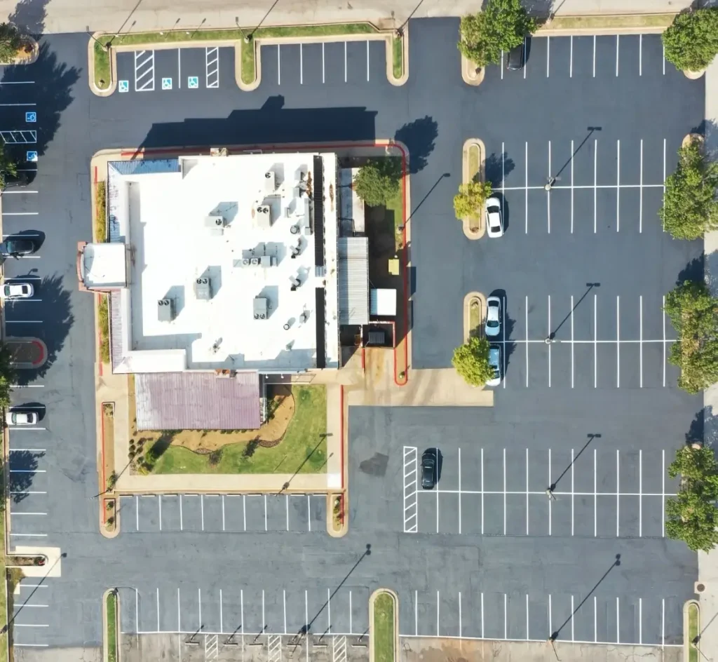 Aerial view of completed parking lot sealcoating and striping project by PavementPro Seal in Oklahoma City.