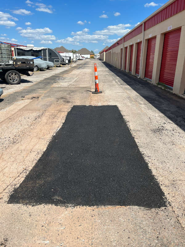 asphalt pavement with new repair