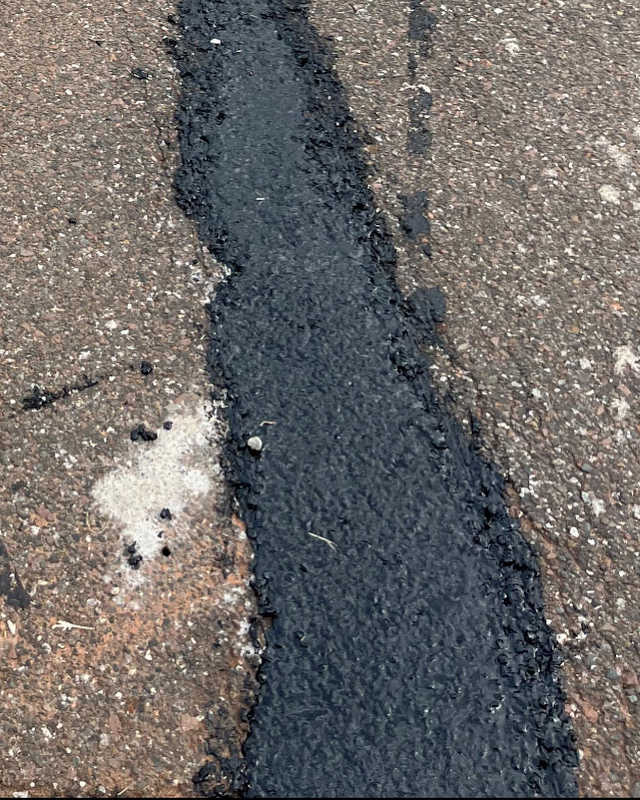 close up of crack sealing in asphalt