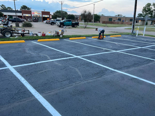Parking lot with new sealcoating and parking stall lines