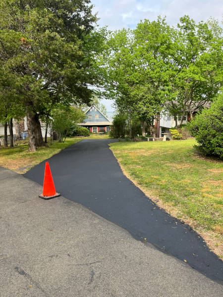 Asphalt driveway with new sealcoating